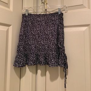 This adorable skirt is a size small.
